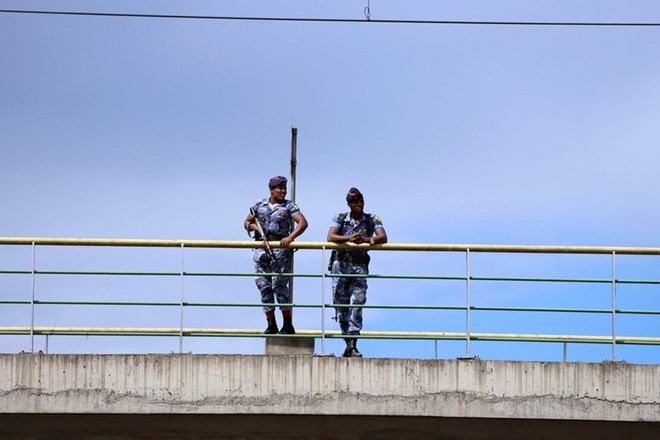 Security officers stand guard during the opening ceremony of Irreecha celebration, the Oromo People thanksgiving ceremony in Addis Ababa, Ethiopia